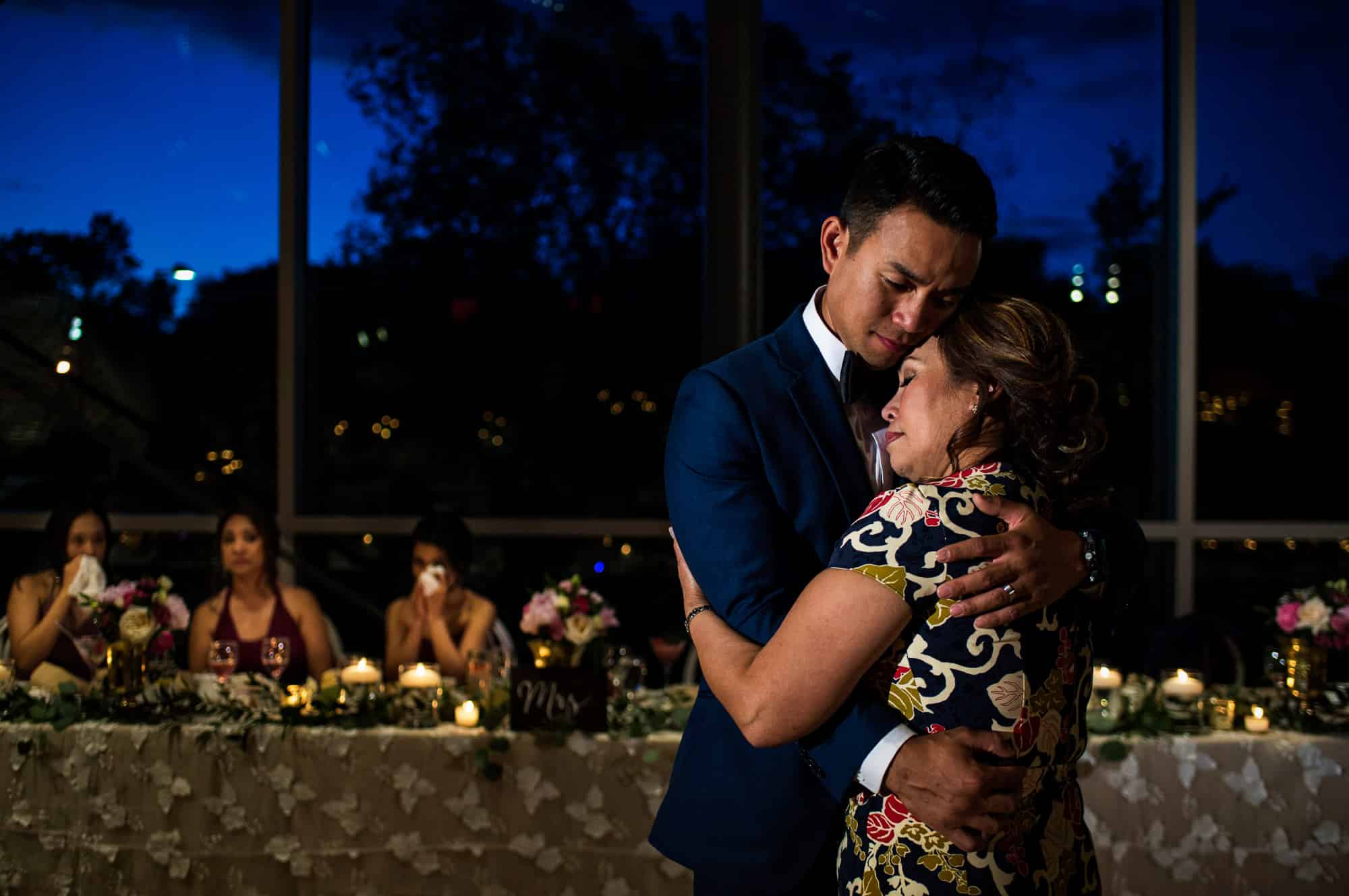 Groom dancing with mom at wedding reception